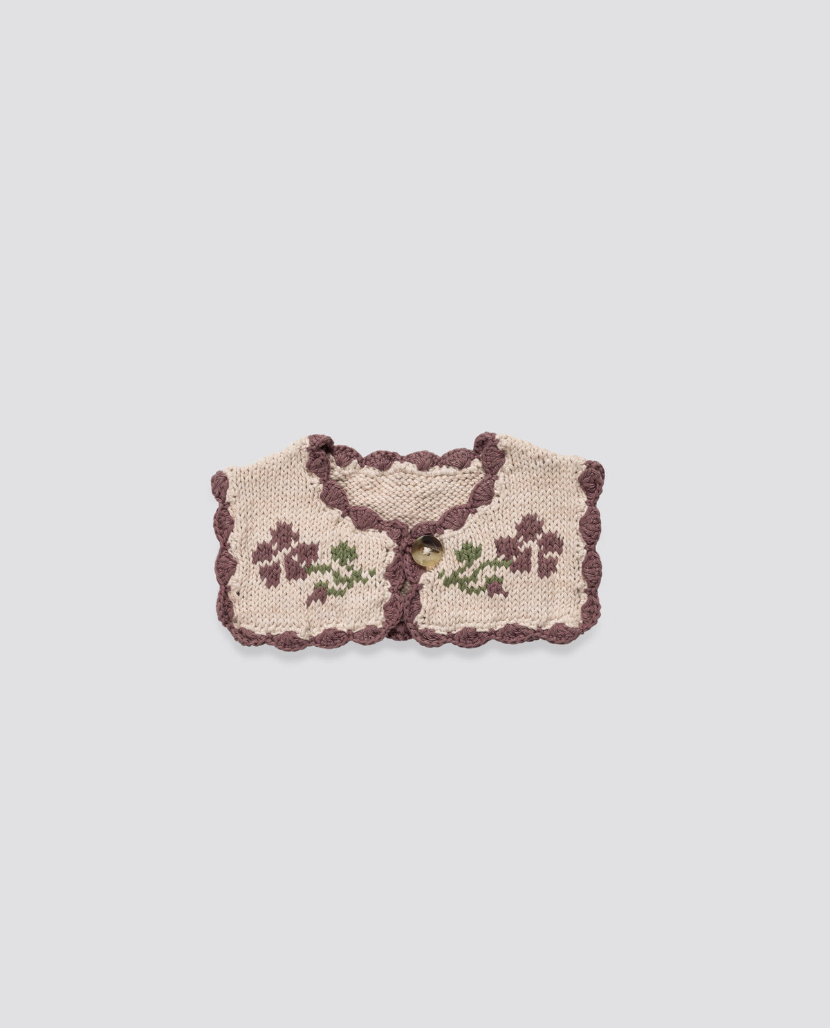Vintage-inspired handknitted collar in cream and plum, with a charming rose design and scalloped edging, sustainably made for ethical children's clothing.