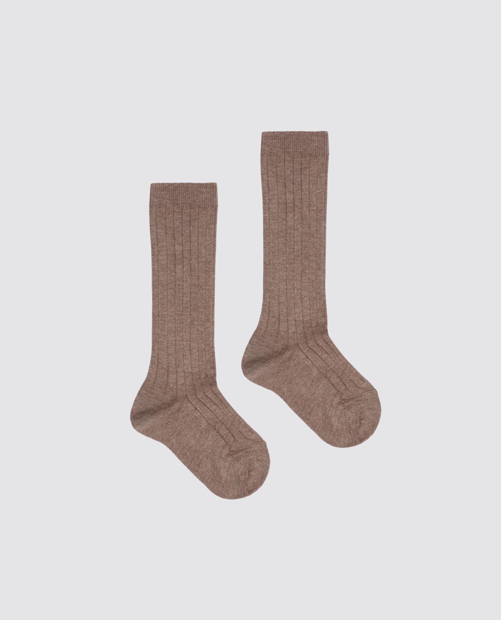 Pair of brown ribbed knee-high socks for kids made from a soft cotton blend, designed with a vintage style and crafted sustainably for comfort and durability.