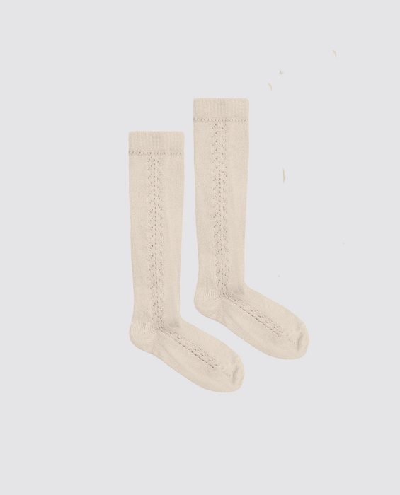 Beautifully made knee high socks for children and toddlers. In a buttermilk colour with openwork design in soft natural cotton.