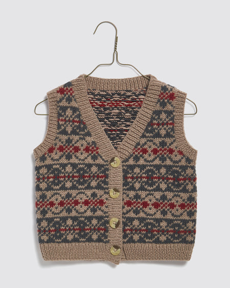 A sweet little boys or girls button up fairisle style tank top or vest.  Hand knitted in the softest 100% Merino wool. Sustainably and ethically made in Nepal.