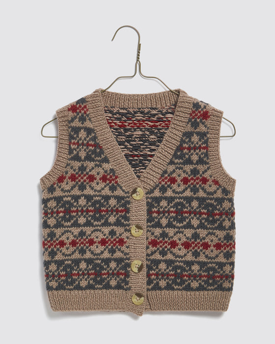 A sweet little boys or girls button up fairisle style tank top or vest.  Hand knitted in the softest 100% Merino wool. Sustainably and ethically made in Nepal.