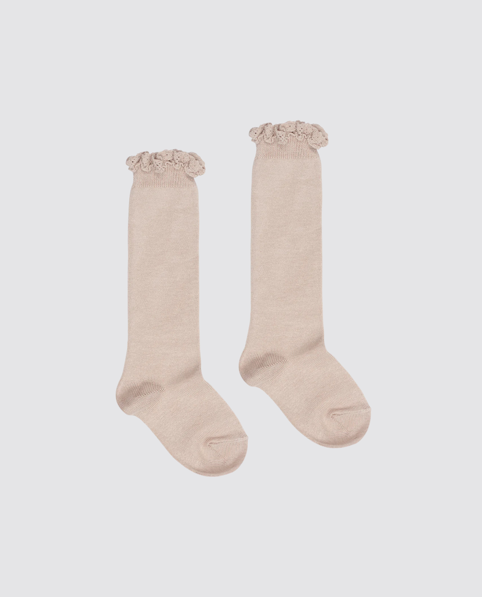 Pair of beige knee-high children’s socks with delicate lace frill edges, made from a soft cotton blend for a natural, vintage-inspired style.