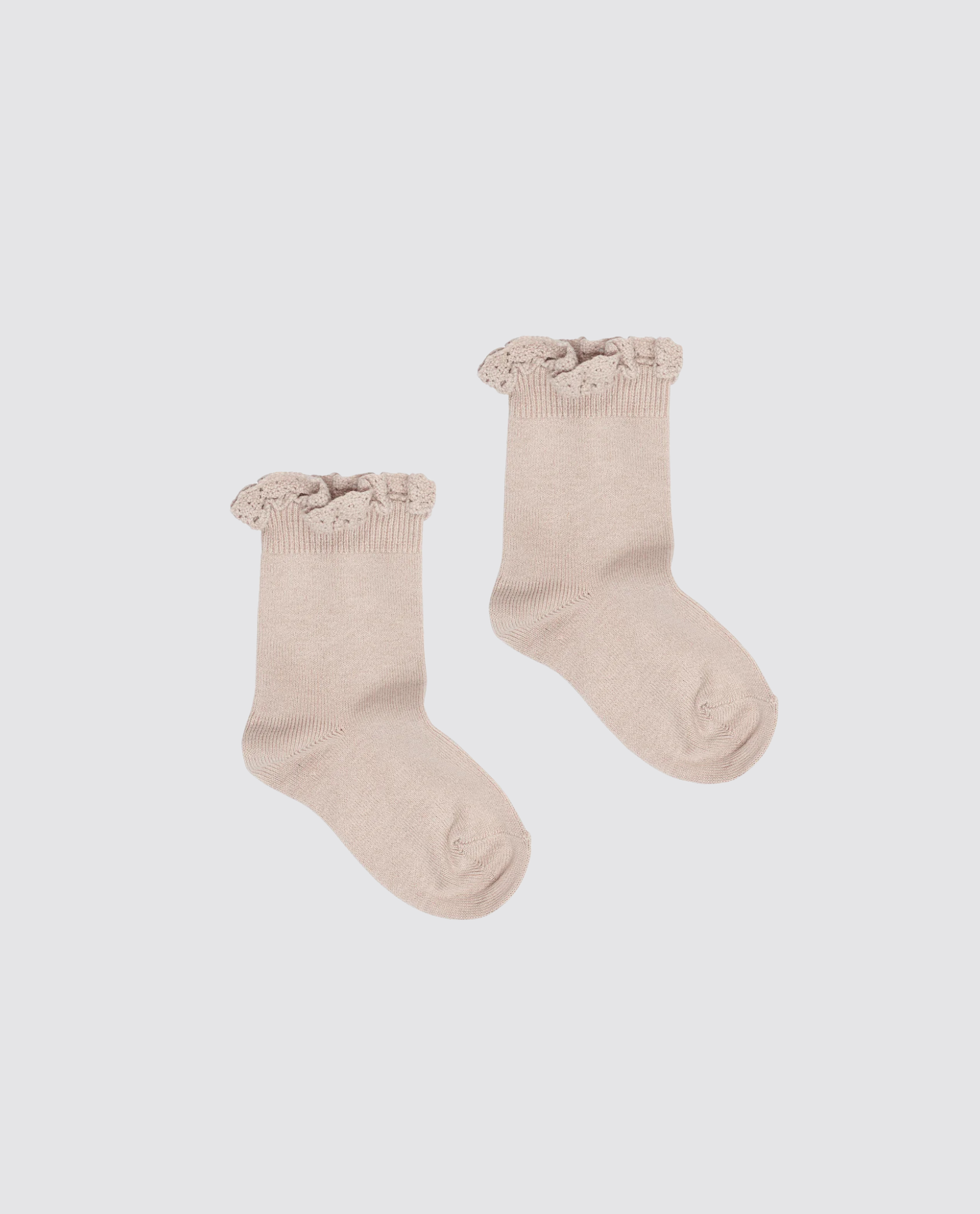 Pair of beige ankle socks for kids made from a soft cotton blend, featuring delicate lace frill detailing, designed with a vintage, sustainable, and ethical approach.