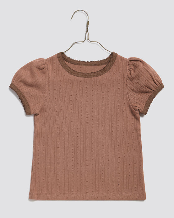 Organic, pointelle jersey, short sleeved girls t-shirt in pink. Round neck, slim fitting gathered sleeve heads. 100% organic cotton plain t shirt.