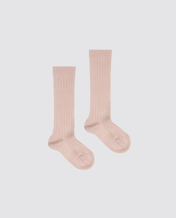 Pair of ribbed knee-high socks for kids in a soft beige cotton blend, designed with a vintage style and made from natural, sustainable materials.